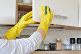 Clean kitchen cabinets with baking soda